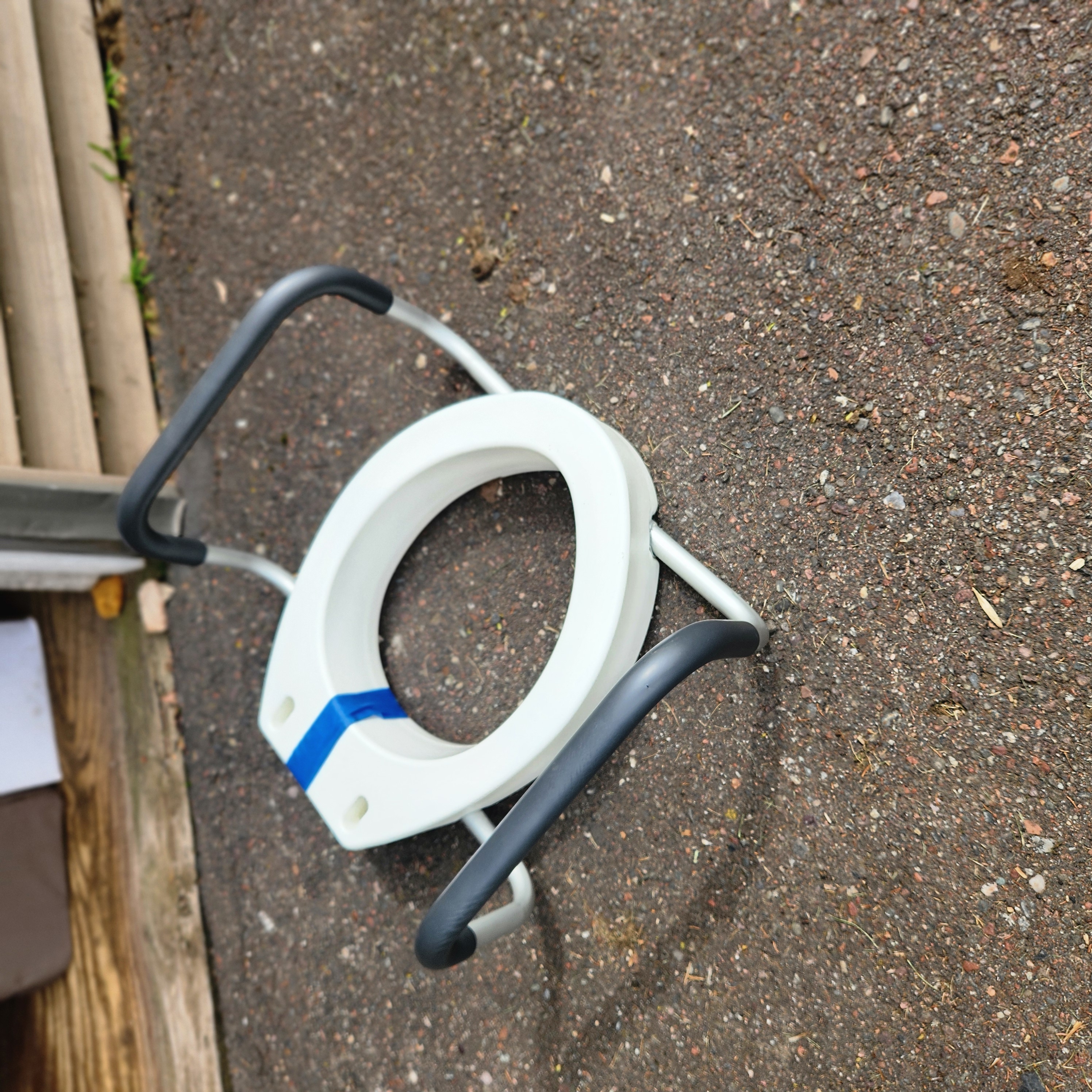 Raised toilet seat with handles