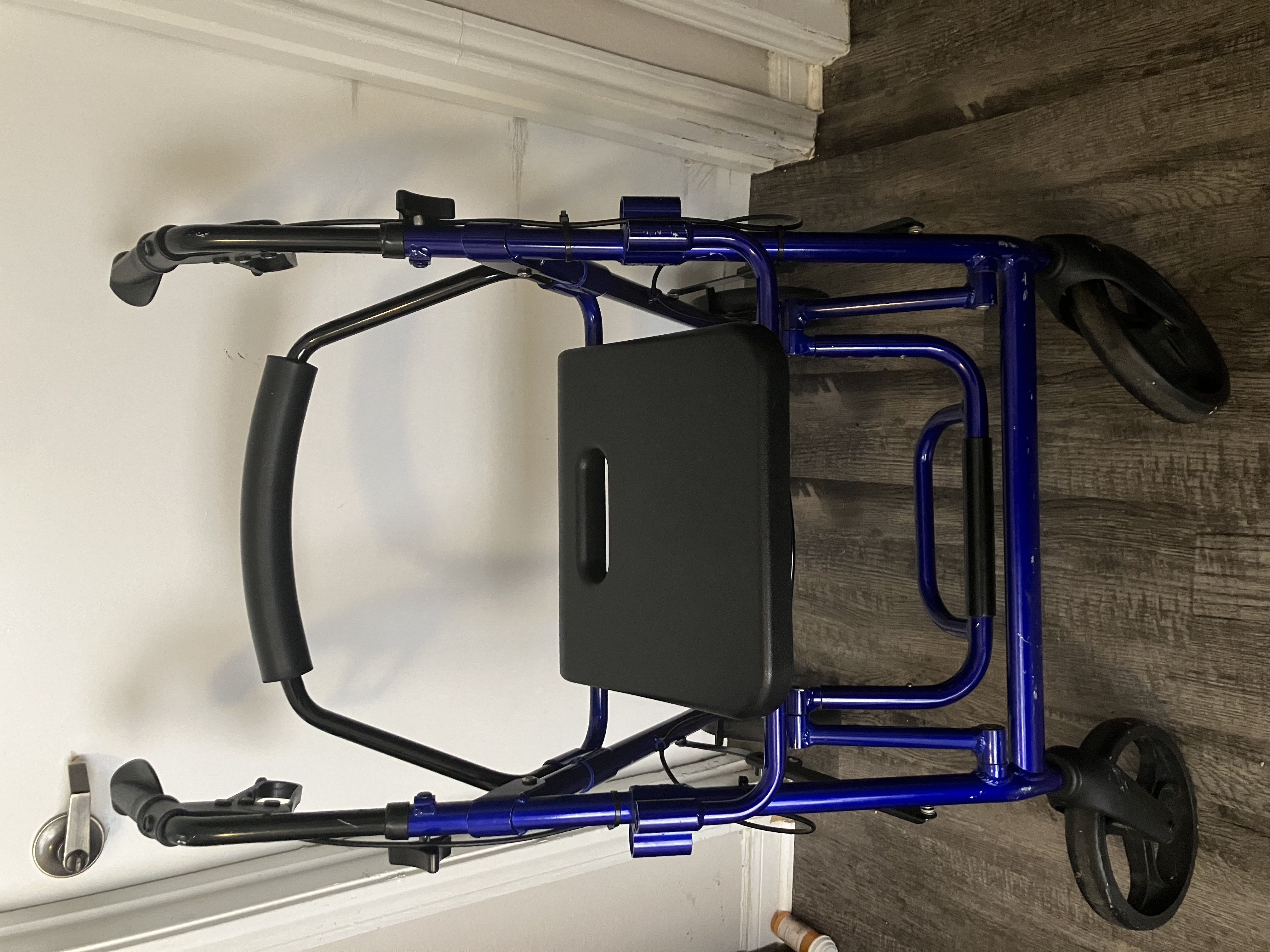 Portable seated walker